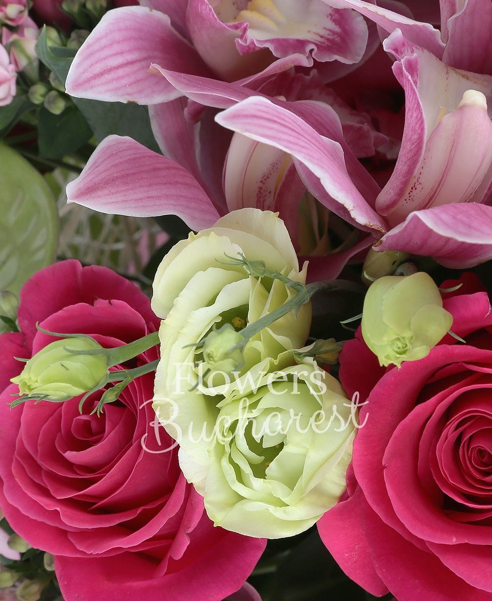 7 cyclam roses, 5 pink lisianthus, 4 pink santini, 7 cream carnations, 3 green lisianthus, 3 sedum, 5 pink bouvardia, 2 green anthurium, pink cymbidium, greenery