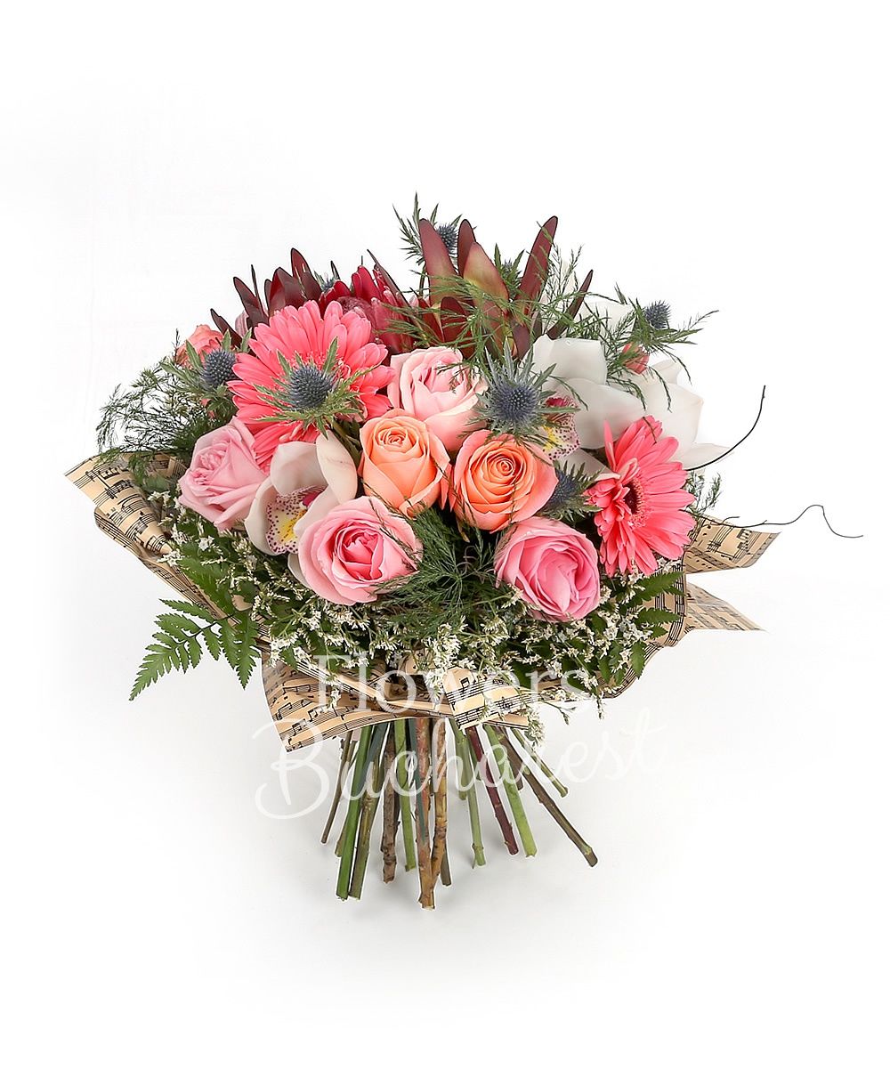 5 pink roses, 5 banana colour roses, 3 pink roses, 3 pink gerbera, 3 proteea, 3 leucadendron, 3 eryngium, white cymbidium, greenery