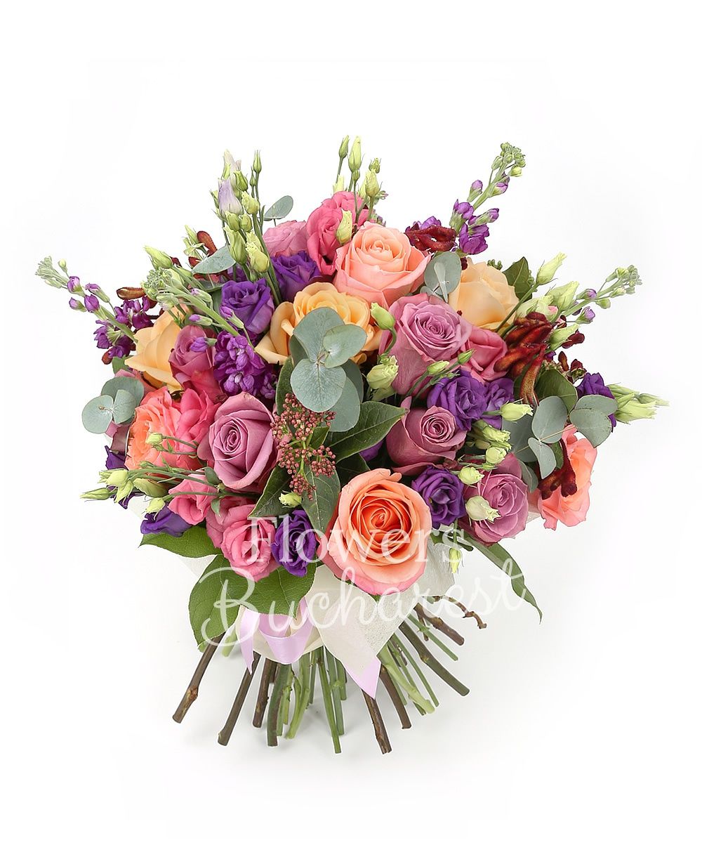 9 mauve roses, 5 banana colour roses, 5 pink roses, 5 mauve lisianthus, 5 mauve matthiola, 3 sedum, 3 anigozanthos, greenery