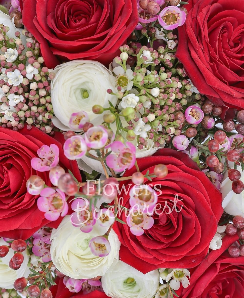 7 red roses, 10 white ranunculus, 5 white sedum, greenery