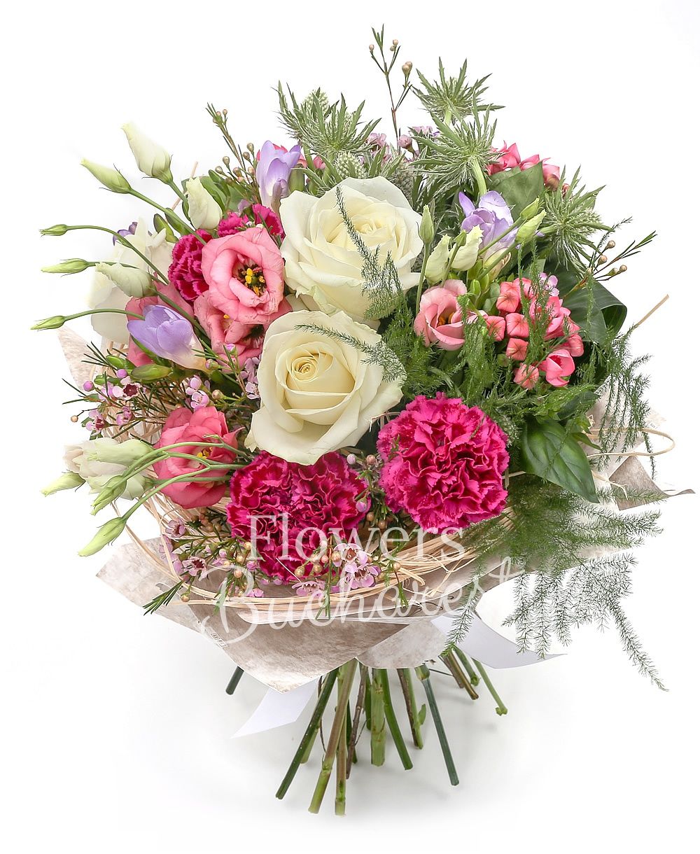 3 white roses, 5 pink lisianthus, 3 white eryngium, 5 purple freesias, 3 cyclam carnations, 3 pink bouvardia, waxflower, greenery