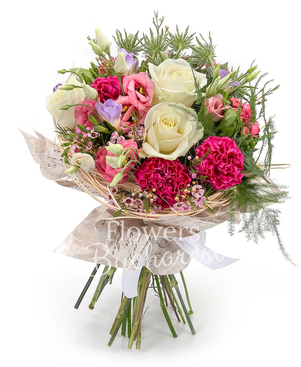 3 white roses, 5 pink lisianthus, 3 white eryngium, 5 purple freesias, 3 cyclam carnations, 3 pink bouvardia, waxflower, greenery